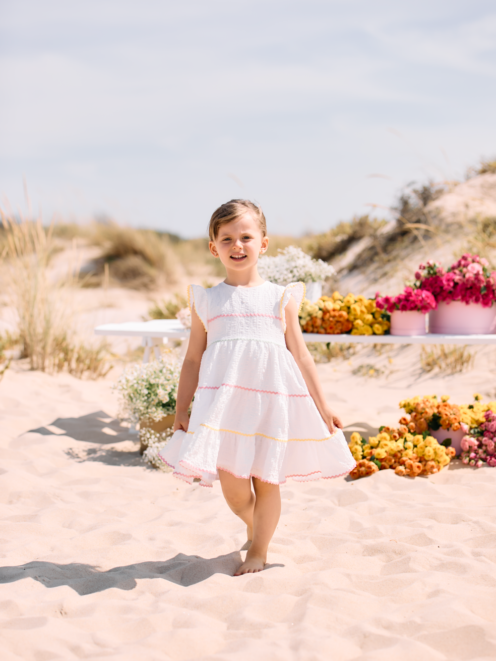 White dress with multicolour trims