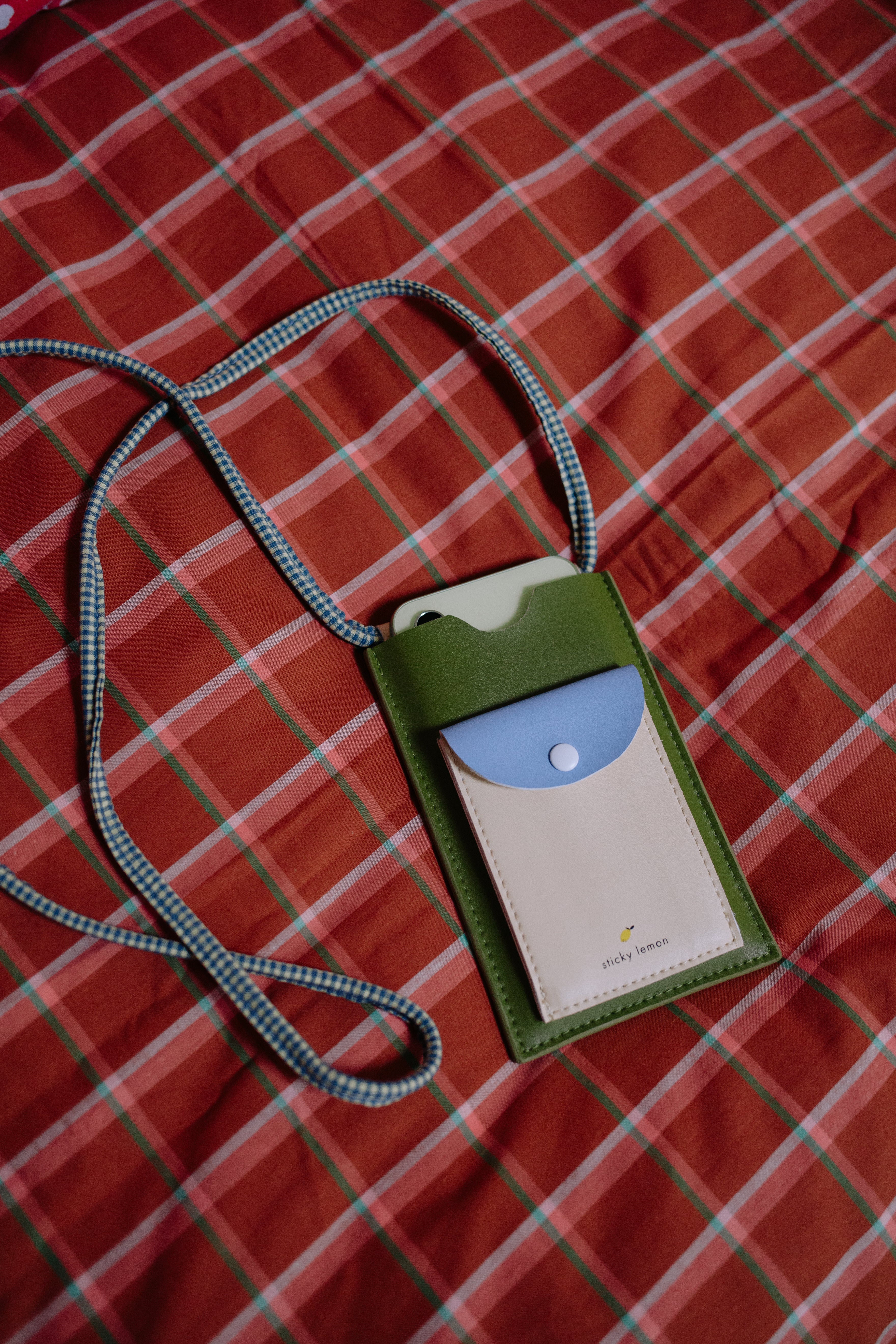 Phone pouch tickling grass