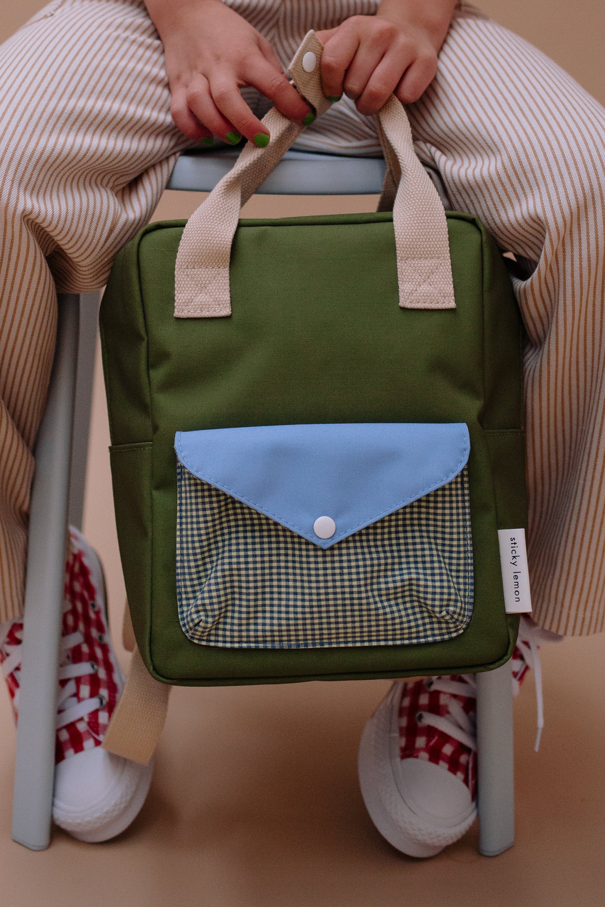 Backpack small envelope tickling grass
