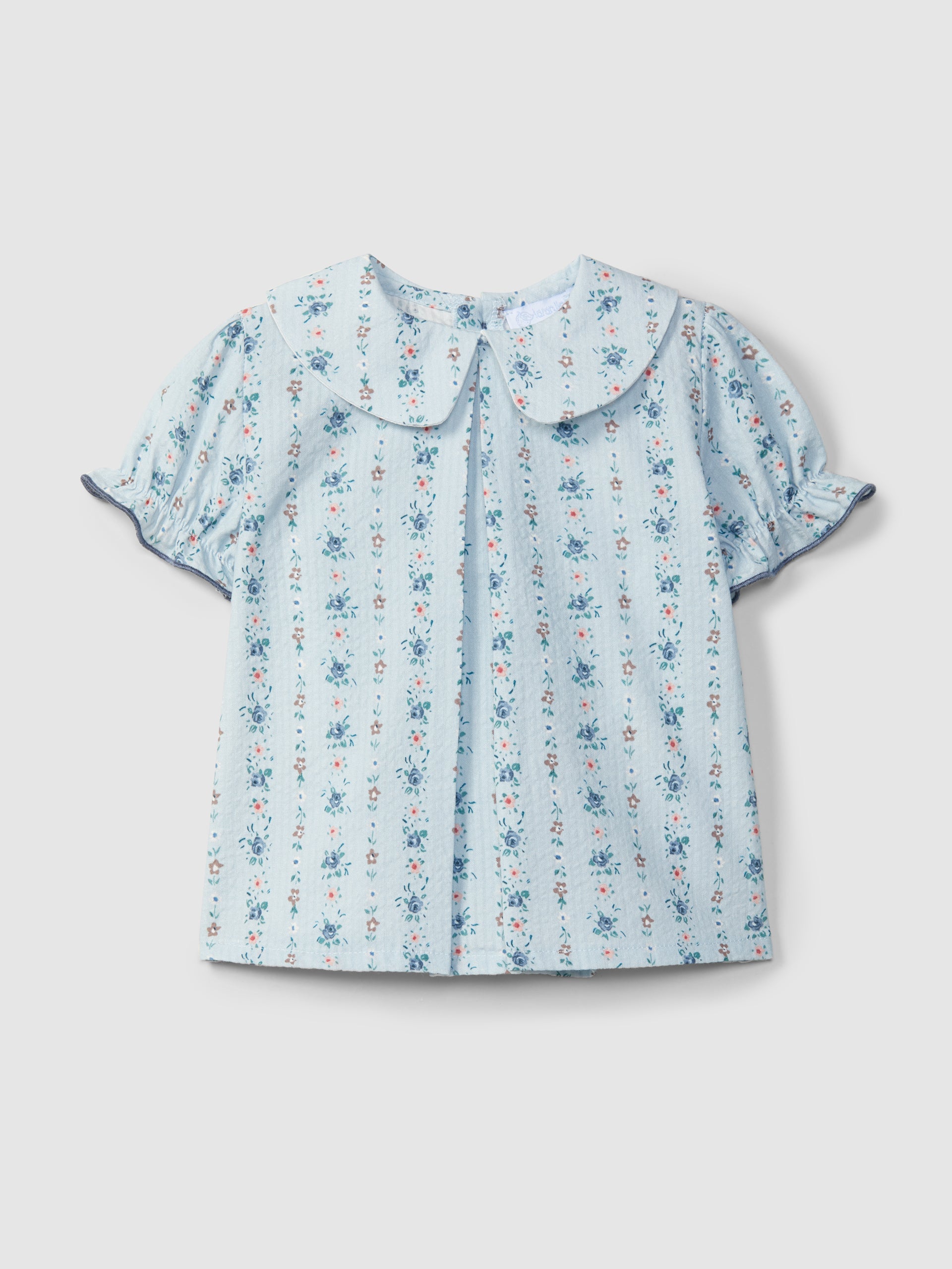 Floral print seersucker blouse and Thin denim pull-up shorts with embroidered details