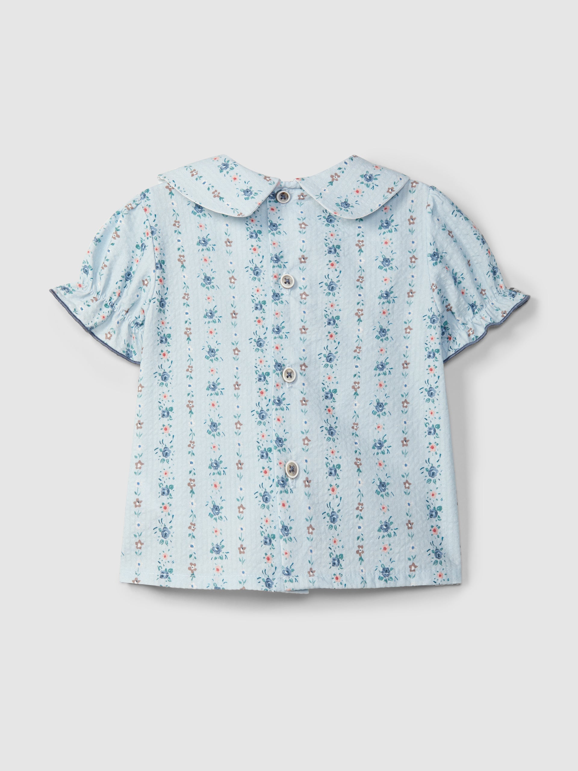 Floral print seersucker blouse and Thin denim pull-up shorts with embroidered details