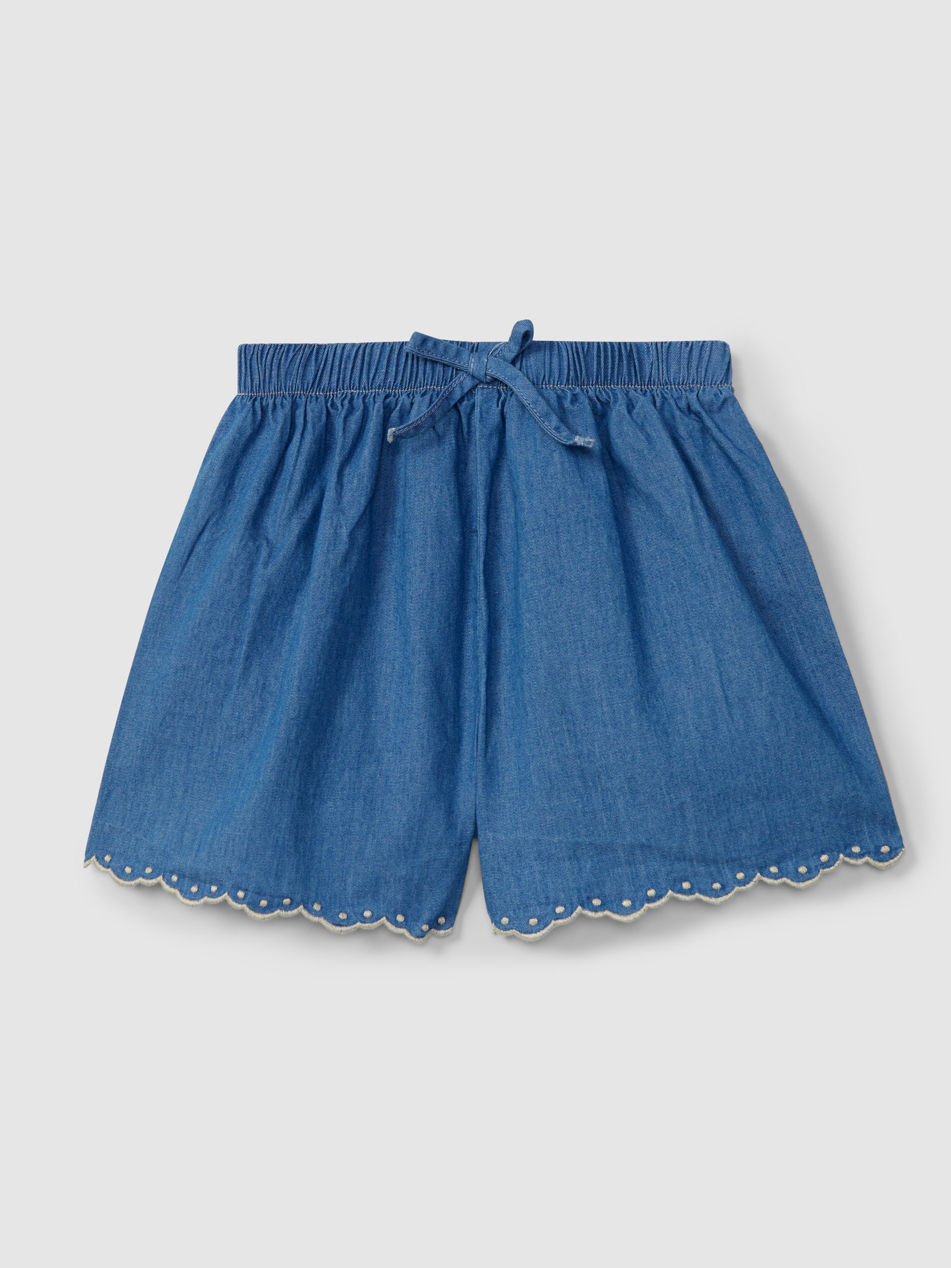 Textured striped fabric top with decorative drawstring and Thin denim pull-up shorts with embroidered details